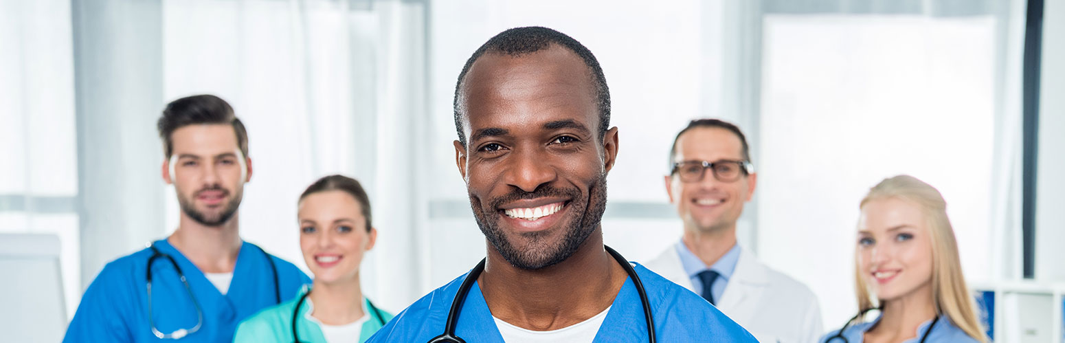 five healthcare professionals looking at the camera